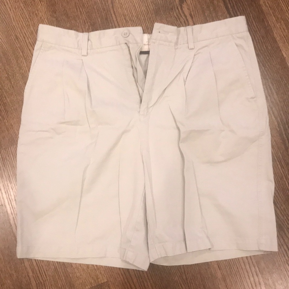 Khaki colored pleated shorts